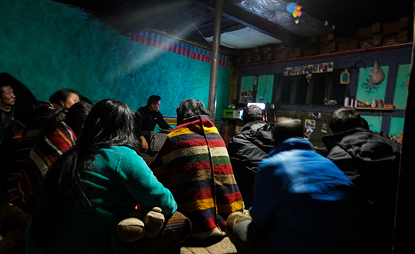 His Majesty on 27th October, watched the North Thimphu by-election debate on BBS, along with the people of Thanza in one of their homes.