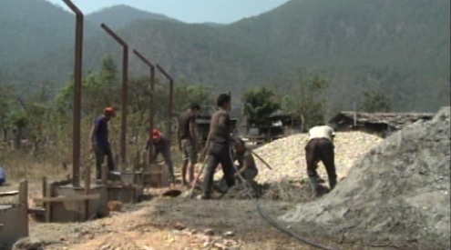 Villagers in Monggar pick up odd jobs to make ends meet