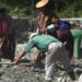 Villagers repair roads, sets example