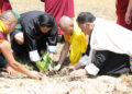 His Majesty plants trees in Punakha