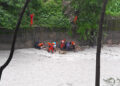 Hundreds work to contain swelling rivers