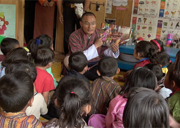 PM reads the Adventures of Pinocchio to ECCD children