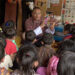 PM reads the Adventures of Pinocchio to ECCD children