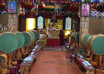 His Eminence Namkhai Nyinpo Rinpoche presides over prayer recitation