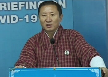 A group of women producing PPE kits locally