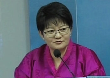 A group of women producing PPE kits locally