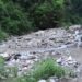 People wait for bridge over Cherung stream