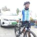 An environmentalist starts month-long cycling campaign to educate students on climate change