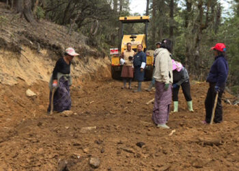 Volunteers help maintain the road to Jela Dzong, Paro