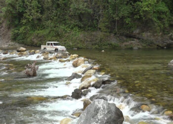 Serchhenmo villagers await bridge over Nyera Ama river