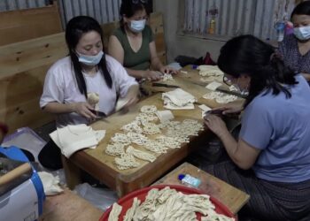 Group of women in Tsirang volunteers to prepare feast offerings, reducing plastic waste at religious events