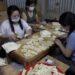 Group of women in Tsirang volunteers to prepare feast offerings, reducing plastic waste at religious events