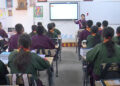 Homework to be assigned in class, not through social media