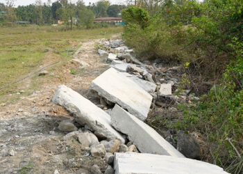 Portion of concrete footpath demolished after Gewog built on private land without approval, Samtse