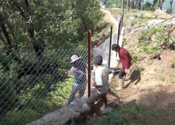 Chain-link fencing to protect farmland in Ramjar Gewog, Trashi Yangtse