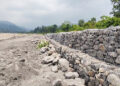 New flood wall brings hope, but residents remain cautious