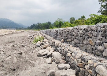 New flood wall brings hope, but residents remain cautious