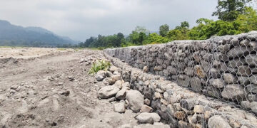 New flood wall brings hope, but residents remain cautious
