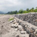 New flood wall brings hope, but residents remain cautious