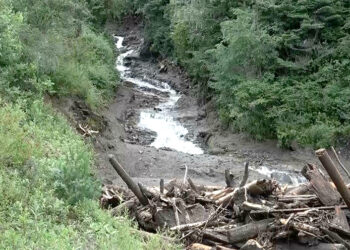 Residents rely on temporary water source after flash flood damages system