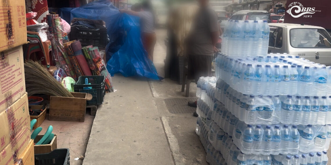 Pedestrians and businesses compete for space on Thimphu footpaths